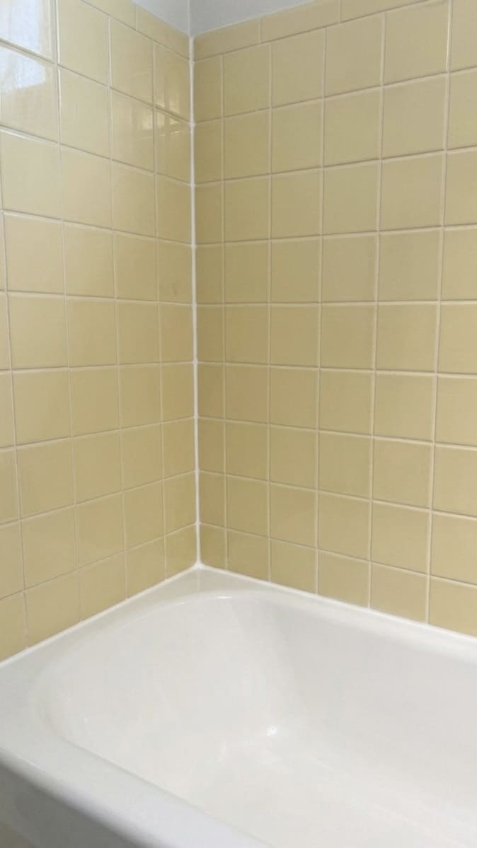 After bathtub corner re-caulking in Markham.