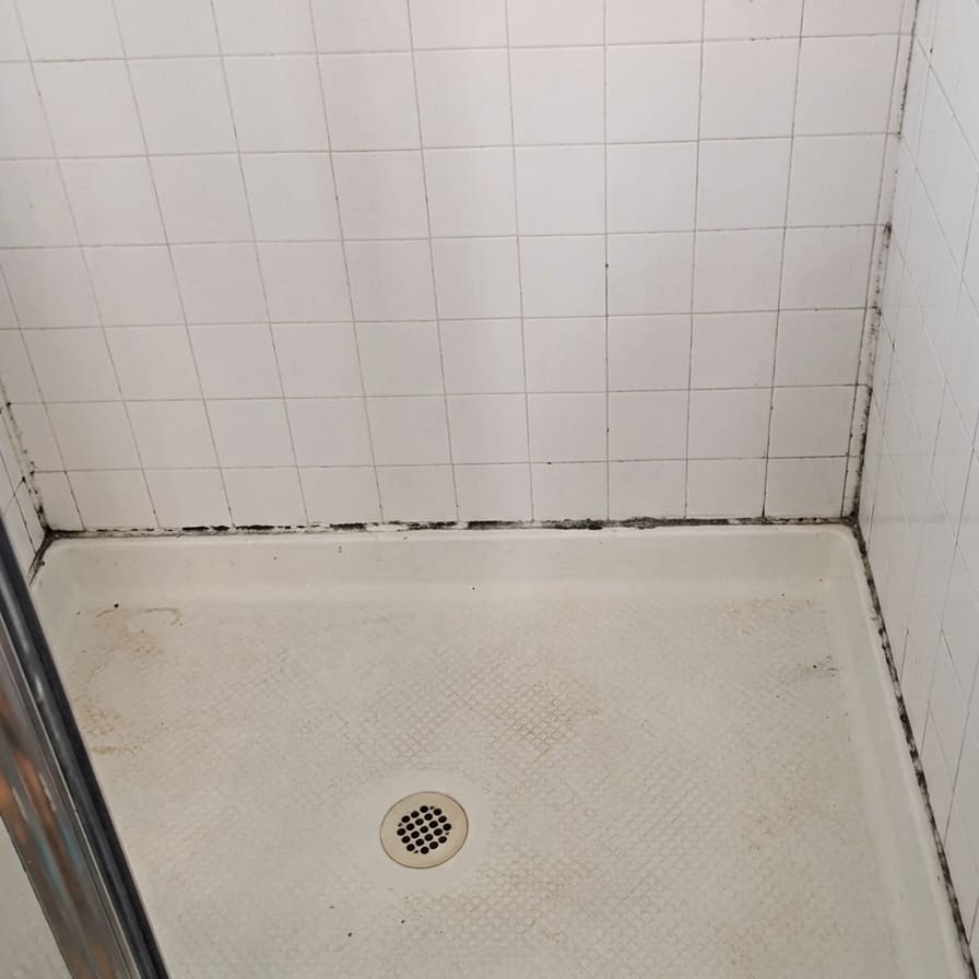 Before shower base perimeter re-caulking in Markham.