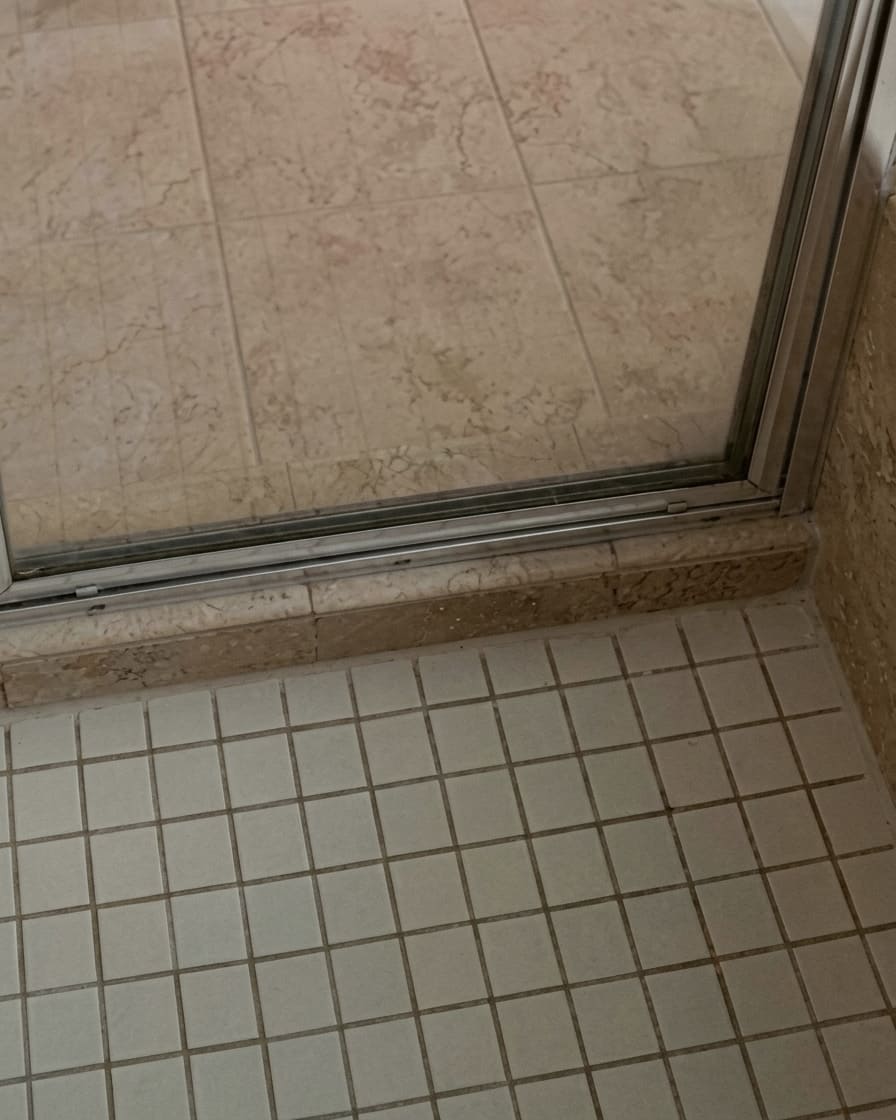 After shower glass base re-caulking in Mississauga.