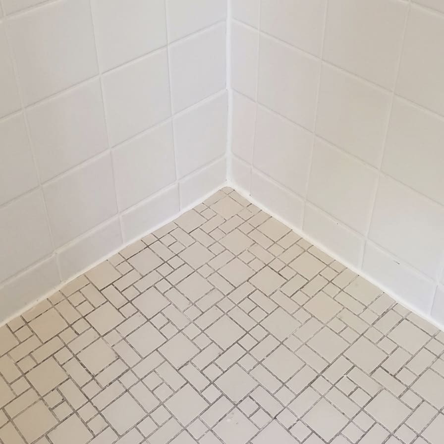 After shower floor corner re-caulking in Oakville.
