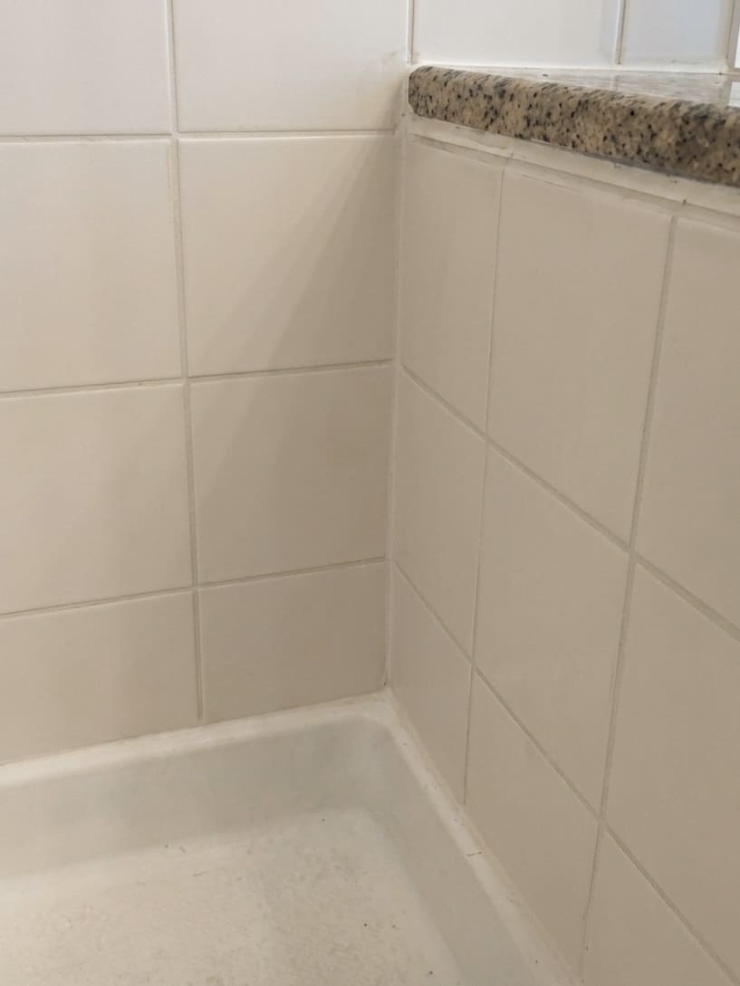 After bathtub corner re-caulking in Richmond Hill.