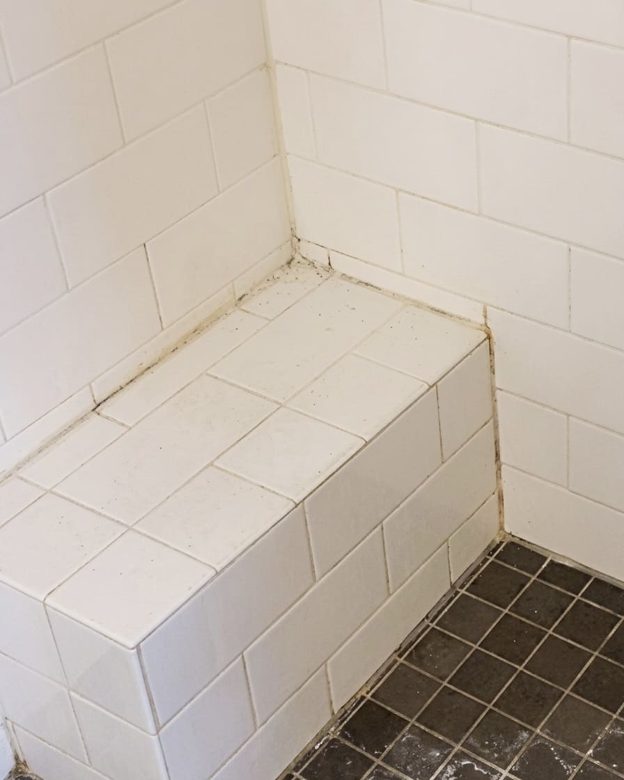 Before shower bench joint re-caulking in Richmond Hill.