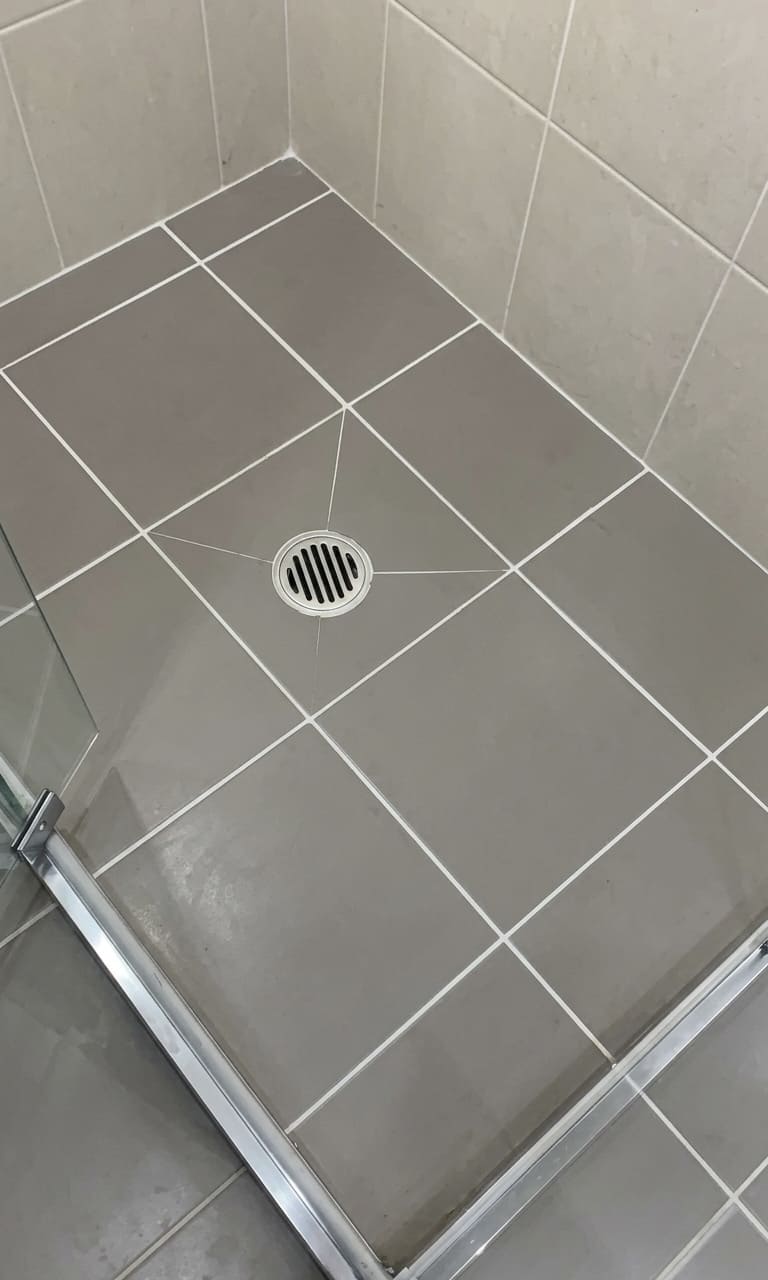 After condo shower floor re-caulking in Toronto.