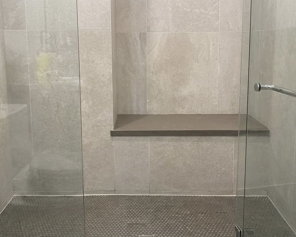 After shower base perimeter re-caulking in Toronto.