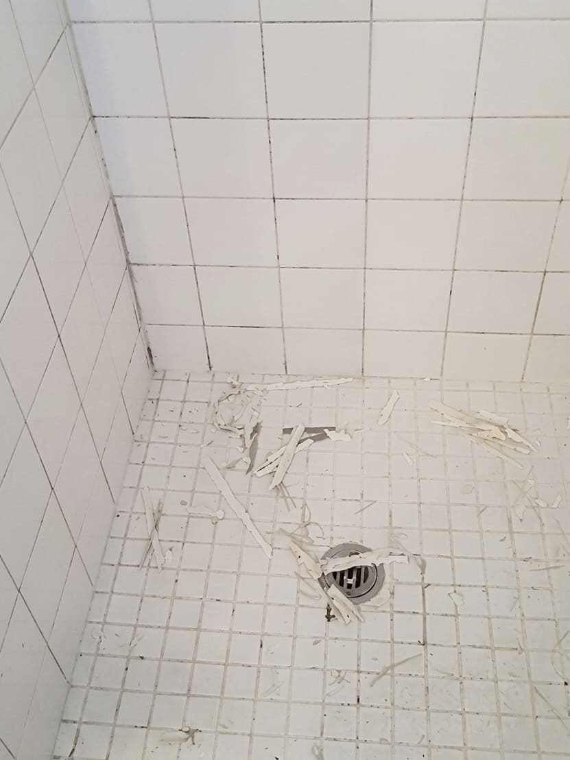 Before shower corner silicone replacement in Toronto.