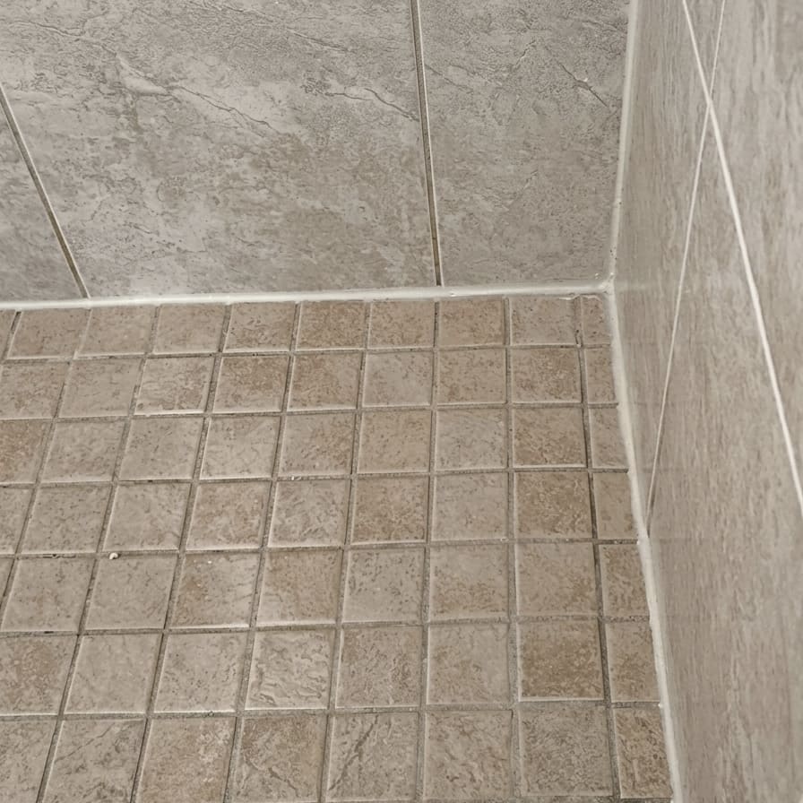 After guest bath shower floor corner re-caulking in Vaughan.