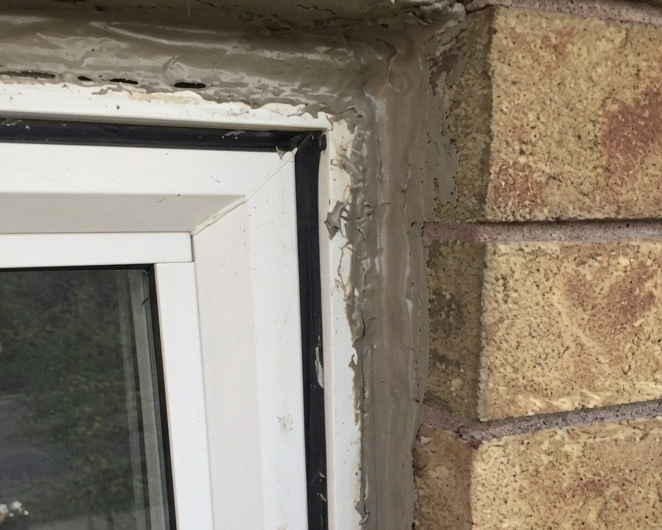 Window in Markham before repair with failed homeowner-applied silicone around the exterior frame