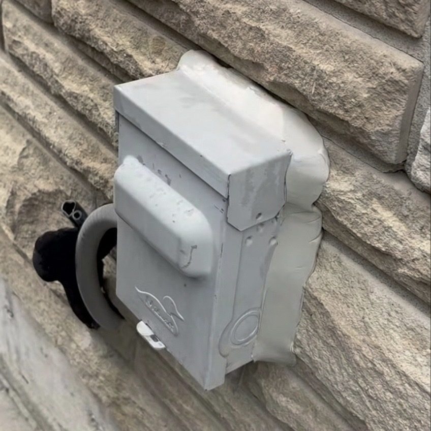 Tooling and smoothing exterior box caulking in Mississauga