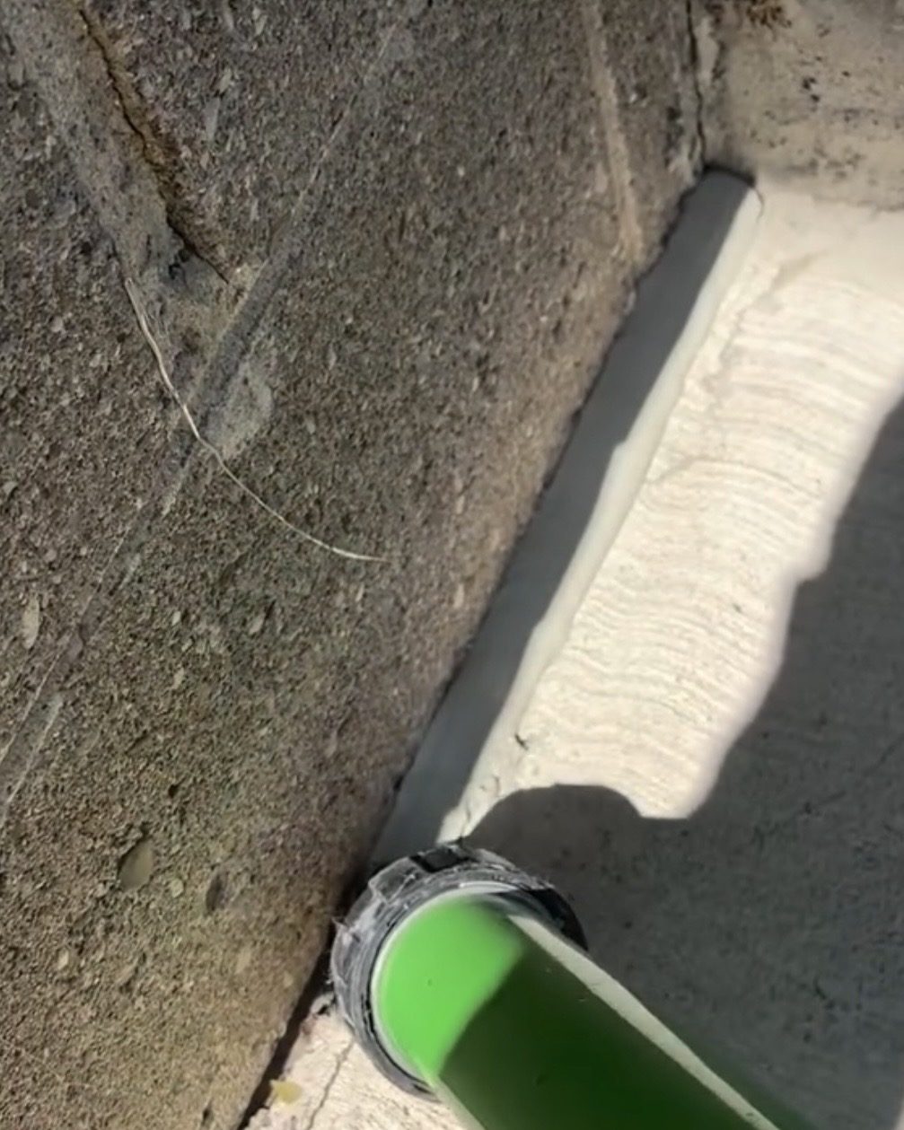 Applying silicone along the foundation joint in Oakville