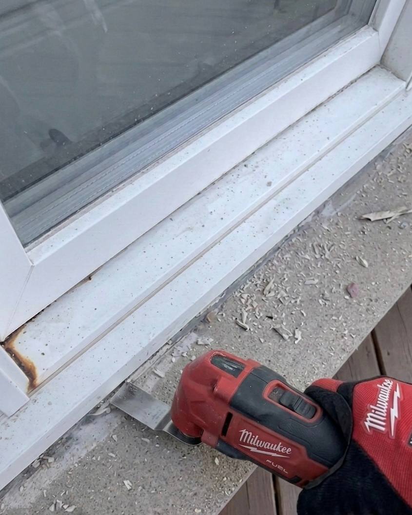 Removing old silicone from a window joint before re-caulking